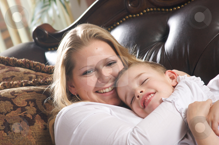 To use this stock image in your creative project, please select the size you need over to the right and click the "Add to Cart" button.
Your downloaded image will come with the Cutcaster watermark removed so don’t worry about the watermark you see on this page. Young Mother and Son stock photo, Young Mother and Son Enjoying a Tender Moment by Andy Dean