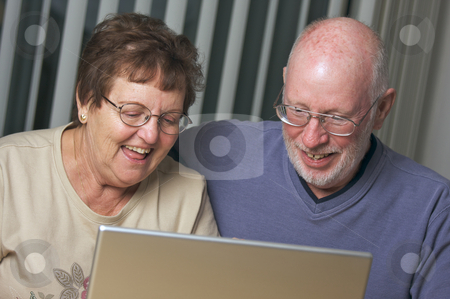 To use this stock image in your creative project, please select the size you need over to the right and click the "Add to Cart" button.
Your downloaded image will come with the Cutcaster watermark removed so don’t worry about the watermark you see on this page. Senior Adults on Laptop Computer stock photo, Senior Adults on Working on a Laptop Computer by Andy Dean