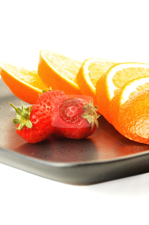 To use this stock image in your creative project, please select the size you need over to the right and click the "Add to Cart" button.
Your downloaded image will come with the Cutcaster watermark removed so don’t worry about the watermark you see on this page. Orange & strawberries stock photo, Orange & strawberries on a plate on white background by Francesco Perre