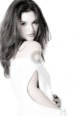 To use this stock image in your creative project, please select the size you need over to the right and click the "Add to Cart" button.
Your downloaded image will come with the Cutcaster watermark removed so don’t worry about the watermark you see on this page. Brunette in white shirt on white background high key looking at stock photo, High key portrait of a brunette girl flirting with the viewer by Frenk and Danielle Kaufmann