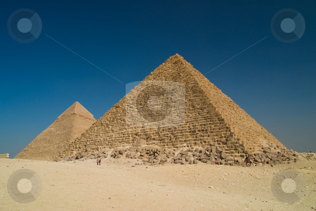 To use this stock image in your creative project, please select the size you need over to the right and click the "Add to Cart" button.
Your downloaded image will come with the Cutcaster watermark removed so don’t worry about the watermark you see on this page. Pyramids in Giza stock photo, Great Pyramid of Khufu on right, and the Pyramid of Khafre on left, Giza Egypt. by Ziga Camernik