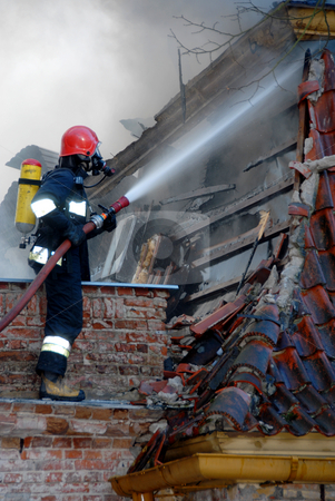 Fireman Fireman stock photo, Firemen on a roof during a house fire. by Joanna Szycik