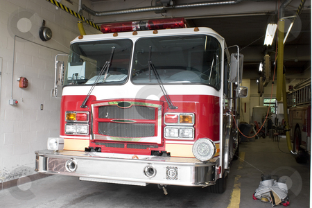 To use this stock image in your creative project, please select the size you need over to the right and click the "Add to Cart" button.
Your downloaded image will come with the Cutcaster watermark removed so don’t worry about the watermark you see on this page. Brand New Fire Truck stock photo, A fire truck is parked in the bay with all of the fire fighting equipment and gear ready to go. by Todd Arena