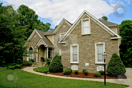 To use this stock image in your creative project, please select the size you need over to the right and click the "Add to Cart" button.
Your downloaded image will come with the Cutcaster watermark removed so don’t worry about the watermark you see on this page. Modern house stock photo, Modern stone house with well kept yard. by Robert Ranson