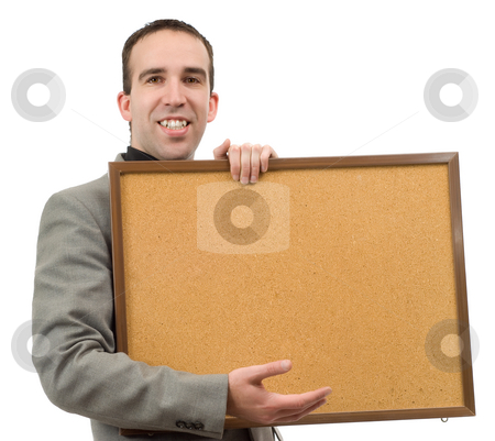 Display Display stock photo, A young businessman holding up some corkboard for your text, isolated against a white background by Richard Nelson