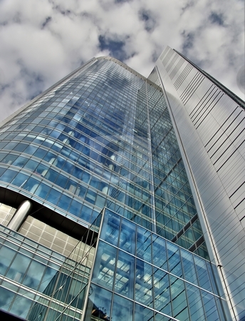 To use this stock image in your creative project, please select the size you need over to the right and click the "Add to Cart" button.
Your downloaded image will come with the Cutcaster watermark removed so don’t worry about the watermark you see on this page. Skyscraper under cloudy sky stock photo, One of the new glass skyscaper in Warsaw Poland by Laurent Dambies