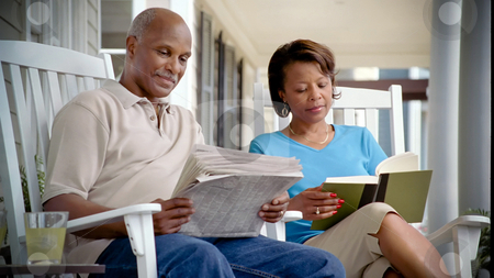 To use this stock image in your creative project, please select the size you need over to the right and click the "Add to Cart" button.
Your downloaded image will come with the Cutcaster watermark removed so don’t worry about the watermark you see on this page. Family On Porch 08 stock photo, A mature man and woman relax on the porch of a suburban home on a summer day. by Jordan Edgcomb