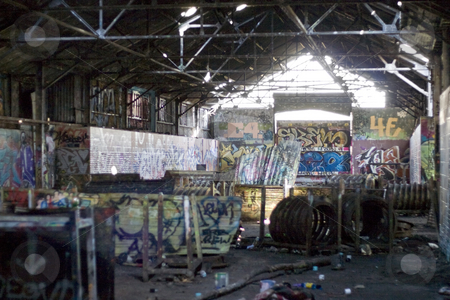 To use this stock image in your creative project, please select the size you need over to the right and click the "Add to Cart" button.
Your downloaded image will come with the Cutcaster watermark removed so don’t worry about the watermark you see on this page. Graffiti Covered Slums stock photo, An old abandoned area that has been converted to a paint ball course. Every inch is covered with graffiti. by Todd Arena