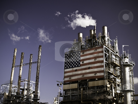 Refinery Complex Refinery Complex stock photo, Part of an oil refinery complex with a big American flag at the front. Fumes coming out of the chimney (low angle view). by Dmytro Bershadskyy
