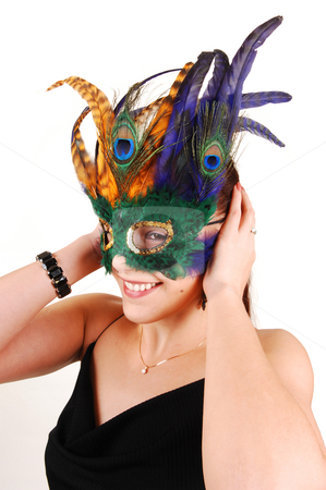 To use this stock image in your creative project, please select the size you need over to the right and click the "Add to Cart" button.
Your downloaded image will come with the Cutcaster watermark removed so don’t worry about the watermark you see on this page. A lovely woman with a mask. stock photo, A smiling young woman with an beautiful feather mask enjoying her
picture taken. by Horst Petzold