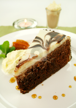 Slice Of Chocolate Cake Slice Of Chocolate Cake stock photo, Rich chocolate cake with orange toffee and cream with a mint garnish. by Brett Mulcahy