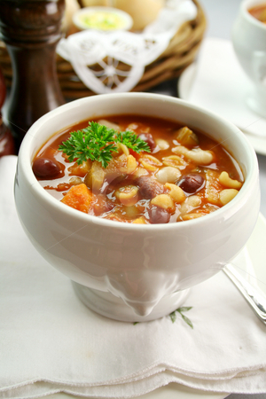 To use this stock image in your creative project, please select the size you need over to the right and click the "Add to Cart" button.
Your downloaded image will come with the Cutcaster watermark removed so don’t worry about the watermark you see on this page. Minestrone Soup stock photo, Delicious minestrone soup with fresh baked bread rolls and butter. by Brett Mulcahy