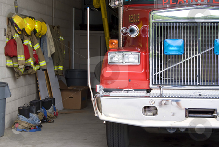 To use this stock image in your creative project, please select the size you need over to the right and click the "Add to Cart" button.
Your downloaded image will come with the Cutcaster watermark removed so don’t worry about the watermark you see on this page. Fire Truck stock photo, A fire truck is parked in the bay with all of the fire fighting equipment and gear ready to go. by Todd Arena