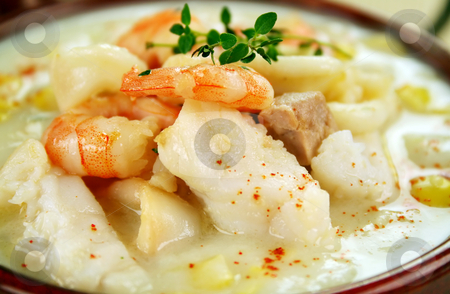 To use this stock image in your creative project, please select the size you need over to the right and click the "Add to Cart" button.
Your downloaded image will come with the Cutcaster watermark removed so don’t worry about the watermark you see on this page. Seafood Chowder stock photo, Delicious thick and creamy seafood chowder with a variety of seafood. by Brett Mulcahy