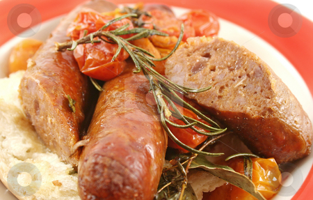 Beef Sausage And Tomato Bake Beef Sausage And Tomato Bake stock photo, Delicious beef sausage and cherry tomato bake with rosemary. by Brett Mulcahy