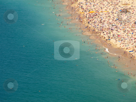 To use this stock image in your creative project, please select the size you need over to the right and click the "Add to Cart" button.
Your downloaded image will come with the Cutcaster watermark removed so don’t worry about the watermark you see on this page. Crowded beach shore stock photo, Concha bay shore in San Sebastian Spain by Laurent Dambies