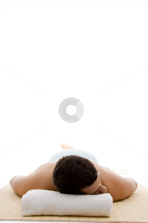Front view of male lying down at day spa Front view of male lying down at day spa stock photo, Front view of male lying down at day spa with white background by Imagery Majestic
