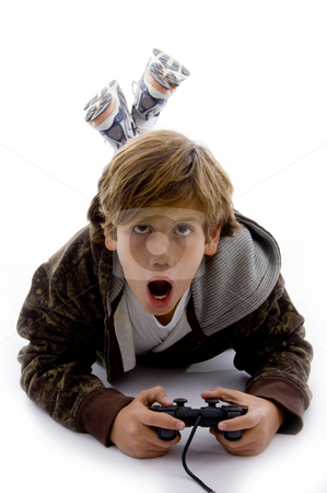 To use this stock image in your creative project, please select the size you need over to the right and click the "Add to Cart" button.
Your downloaded image will come with the Cutcaster watermark removed so don’t worry about the watermark you see on this page. Front view of surprised kid playing videogame stock photo, Front view of surprised kid playing videogame on an isolated white background by Imagery Majestic