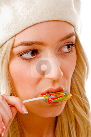 To use this stock image in your creative project, please select the size you need over to the right and click the "Add to Cart" button.
Your downloaded image will come with the Cutcaster watermark removed so don’t worry about the watermark you see on this page. Portrait of smiling female licking candy stock photo, Portrait of smiling female licking candy on an isolated white background by Imagery Majestic