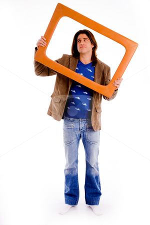 Front view of male holding frame and looking up Front view of male holding frame and looking up stock photo, Front view of male holding frame and looking up against white background by Imagery Majestic