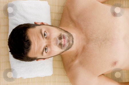 High angle view of man receiving hot stone massage High angle view of man receiving hot stone massage stock photo, High angle view of man receiving hot stone massage by Imagery Majestic