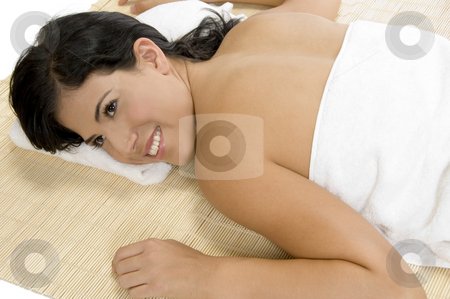 Happy woman laying on bamboo mat Happy woman laying on bamboo mat stock photo, Happy woman laying on bamboo mat by Imagery Majestic