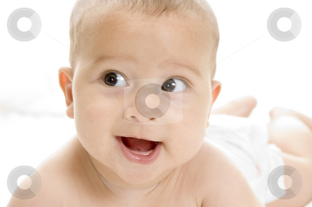 To use this stock image in your creative project, please select the size you need over to the right and click the "Add to Cart" button.
Your downloaded image will come with the Cutcaster watermark removed so don’t worry about the watermark you see on this page. Smiling baby lying stock photo, Smiling baby lying with white background by Imagery Majestic