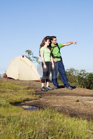 To use this stock image in your creative project, please select the size you need over to the right and click the "Add to Cart" button.
Your downloaded image will come with the Cutcaster watermark removed so don’t worry about the watermark you see on this page. Couple Camping stock photo, Vertically framed shot of an attractive young couple camping by Orange Line Media