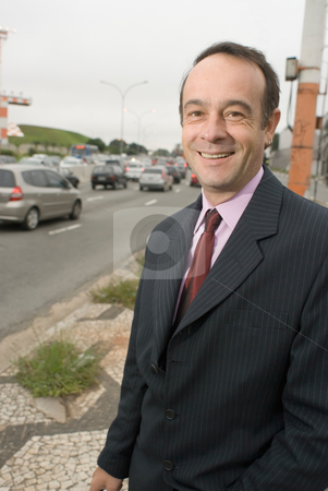 To use this stock image in your creative project, please select the size you need over to the right and click the "Add to Cart" button.
Your downloaded image will come with the Cutcaster watermark removed so don’t worry about the watermark you see on this page. Businessman by the Roadside stock photo, A shot of a businessman standing by a road. by Orange Line Media