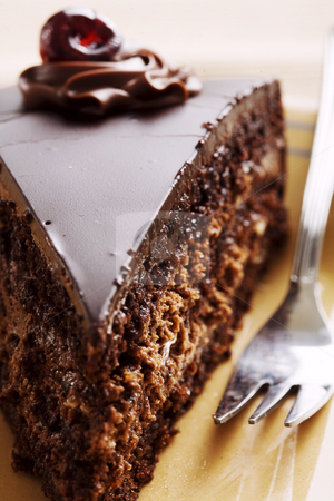 To use this stock image in your creative project, please select the size you need over to the right and click the "Add to Cart" button.
Your downloaded image will come with the Cutcaster watermark removed so don’t worry about the watermark you see on this page. Chocolate cake slice stock photo, Closeup of slice of tasty chocolate cake by Liv Friis-Larsen