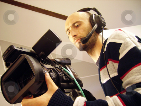 To use this stock image in your creative project, please select the size you need over to the right and click the "Add to Cart" button.
Your downloaded image will come with the Cutcaster watermark removed so don’t worry about the watermark you see on this page. Cameraman stock photo, Image with a television cameraman working with camera by Tudor Antonel adrian