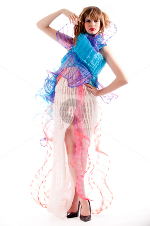 To use this stock image in your creative project, please select the size you need over to the right and click the "Add to Cart" button.
Your downloaded image will come with the Cutcaster watermark removed so don’t worry about the watermark you see on this page. Teenage girl in a stylised dress striking a pose stock photo, Studio portrait of a teenage girl stylising a pose by Frenk and Danielle Kaufmann