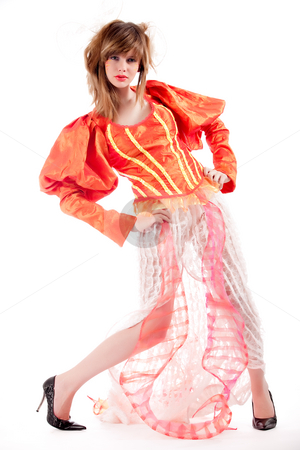 To use this stock image in your creative project, please select the size you need over to the right and click the "Add to Cart" button.
Your downloaded image will come with the Cutcaster watermark removed so don’t worry about the watermark you see on this page. Cute teenage girl in an orange fancy dress posing stock photo, Studio portrait of a girl in a special stylised dress by Frenk and Danielle Kaufmann