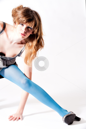 To use this stock image in your creative project, please select the size you need over to the right and click the "Add to Cart" button.
Your downloaded image will come with the Cutcaster watermark removed so don’t worry about the watermark you see on this page. Teenager in blue pantyhose and grey blouse stretching stock photo, Studio portrait of a cute teenager by Frenk and Danielle Kaufmann
