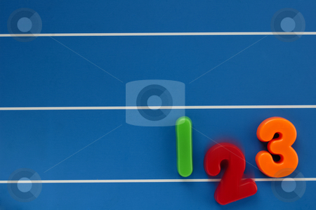 To use this stock image in your creative project, please select the size you need over to the right and click the "Add to Cart" button.
Your downloaded image will come with the Cutcaster watermark removed so don’t worry about the watermark you see on this page. Drop-out stock photo, The numbers 1, 2 and 3 from a child's toy learning set, on a blue, lined background. The number 2 dropping out of the line, with motion blur. by Alistair Scott
