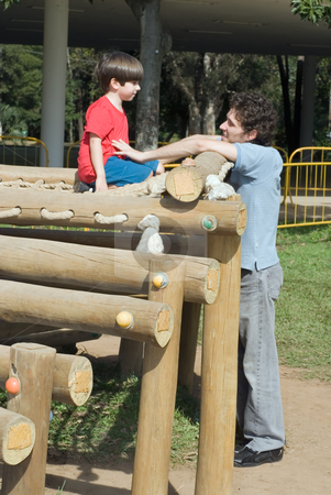 Father and Son Father and Son stock photo, Father and son sharing a quiet moment at the playground on a cool, sunny, day. by Orange Line Media