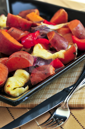 To use this stock image in your creative project, please select the size you need over to the right and click the "Add to Cart" button.
Your downloaded image will come with the Cutcaster watermark removed so don’t worry about the watermark you see on this page. Roasted sweet potatoes stock photo, Vegetarian dish of roasted yams with cheese and peppers by Elena Elisseeva