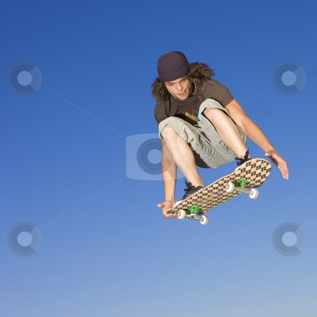Skateboard tricks Skateboard tricks stock photo, Teen boy does tricks in the half pipe at a skate park by Rick Becker-Leckrone