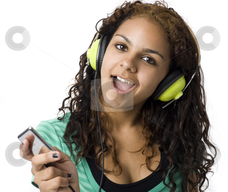 To use this stock image in your creative project, please select the size you need over to the right and click the "Add to Cart" button.
Your downloaded image will come with the Cutcaster watermark removed so don’t worry about the watermark you see on this page. Girl listens to headphones stock photo, A girl sings and listens to headphones by Rick Becker-Leckrone