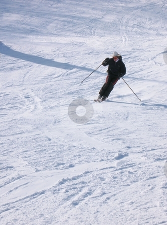 A Happy Skier A Happy Skier stock photo, A skier coming down from the mountain, turning into a traverse to change direction, throwing up some snow. by Ray Carpenter