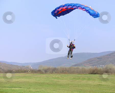 To use this stock image in your creative project, please select the size you need over to the right and click the "Add to Cart" button.
Your downloaded image will come with the Cutcaster watermark removed so don’t worry about the watermark you see on this page. Parachutist landing stock photo, Parachutist landing on a field after good flight. by Ivan Paunovic