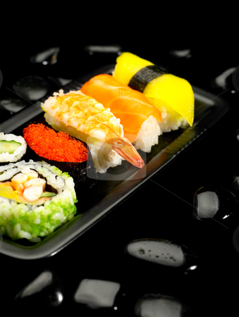 To use this stock image in your creative project, please select the size you need over to the right and click the "Add to Cart" button.
Your downloaded image will come with the Cutcaster watermark removed so don’t worry about the watermark you see on this page. Sushi plate stock photo, Fresh colorfull sushi plate over black pebbles by Francesco Perre