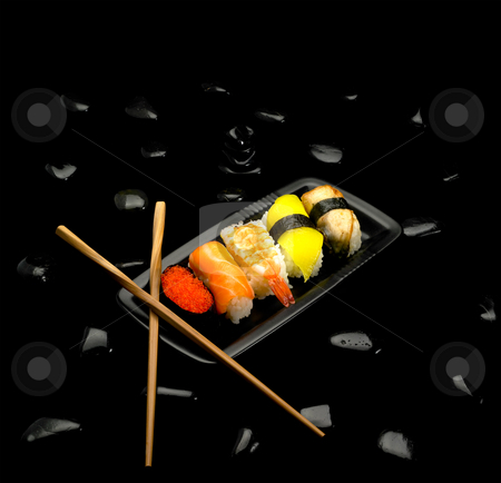 Sushi plate Sushi plate stock photo, Fresh colorfull sushi plate over black pebbles by Francesco Perre