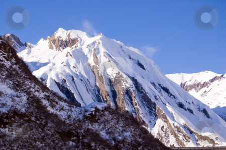Windy snowy peak Windy snowy peak stock photo, A mountain peak full of snow and ruffled by wind, Formazza Valle Ossola, Italy by Roberto Marinello