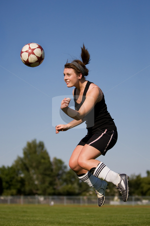 Woman soccer player Woman soccer player stock photo, A female soccer player heading the ball by Steve Mcsweeny