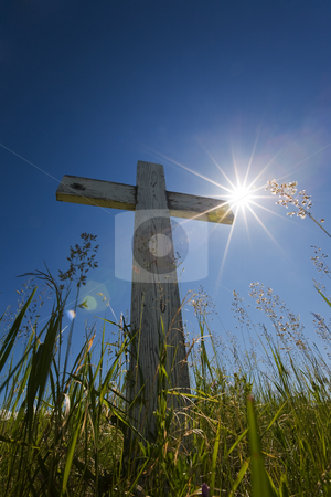 To use this stock image in your creative project, please select the size you need over to the right and click the "Add to Cart" button.
Your downloaded image will come with the Cutcaster watermark removed so don’t worry about the watermark you see on this page. Grave in sunlight stock photo, Old wooden cross in a graveyard with sun flares by Steve Mcsweeny