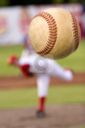 To use this stock image in your creative project, please select the size you need over to the right and click the "Add to Cart" button.
Your downloaded image will come with the Cutcaster watermark removed so don’t worry about the watermark you see on this page. The pitch stock photo, A baseball player pitching with spin on the ball. (motion blur on ball) by Steve Mcsweeny