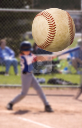 Baseball hit Baseball hit stock photo, Young baseball player hitting a home run , focus on the ball with motion blur by Steve Mcsweeny