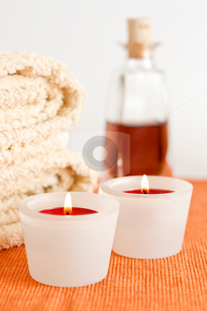 To use this stock image in your creative project, please select the size you need over to the right and click the "Add to Cart" button.
Your downloaded image will come with the Cutcaster watermark removed so don’t worry about the watermark you see on this page. Candles, Massage Oil, Towels stock photo, A set of burning red candles, massage oil and towels by Alexander Zschach