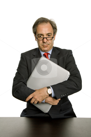 To use this stock image in your creative project, please select the size you need over to the right and click the "Add to Cart" button.
Your downloaded image will come with the Cutcaster watermark removed so don’t worry about the watermark you see on this page. Executive stock photo, Mature business man with his laptop, isolated on white by Rui Vale de Sousa